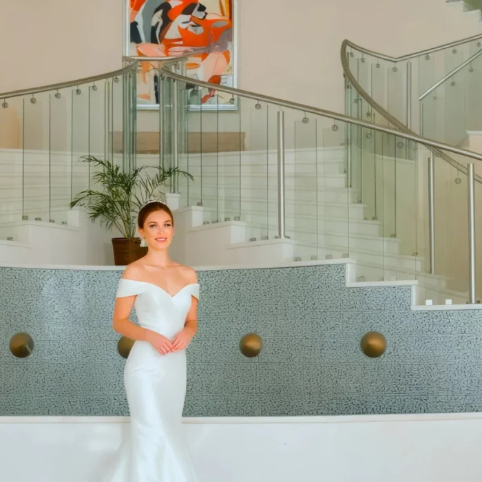 Bride and groom at the lobby staircase venue Iberostar Selection Rose Hall Suites