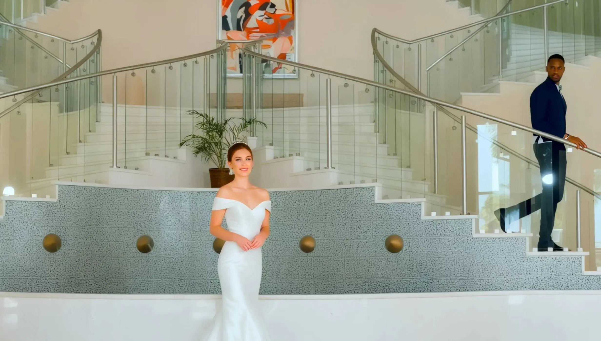 Bride and groom at the lobby staircase venue Iberostar Selection Rose Hall Suites