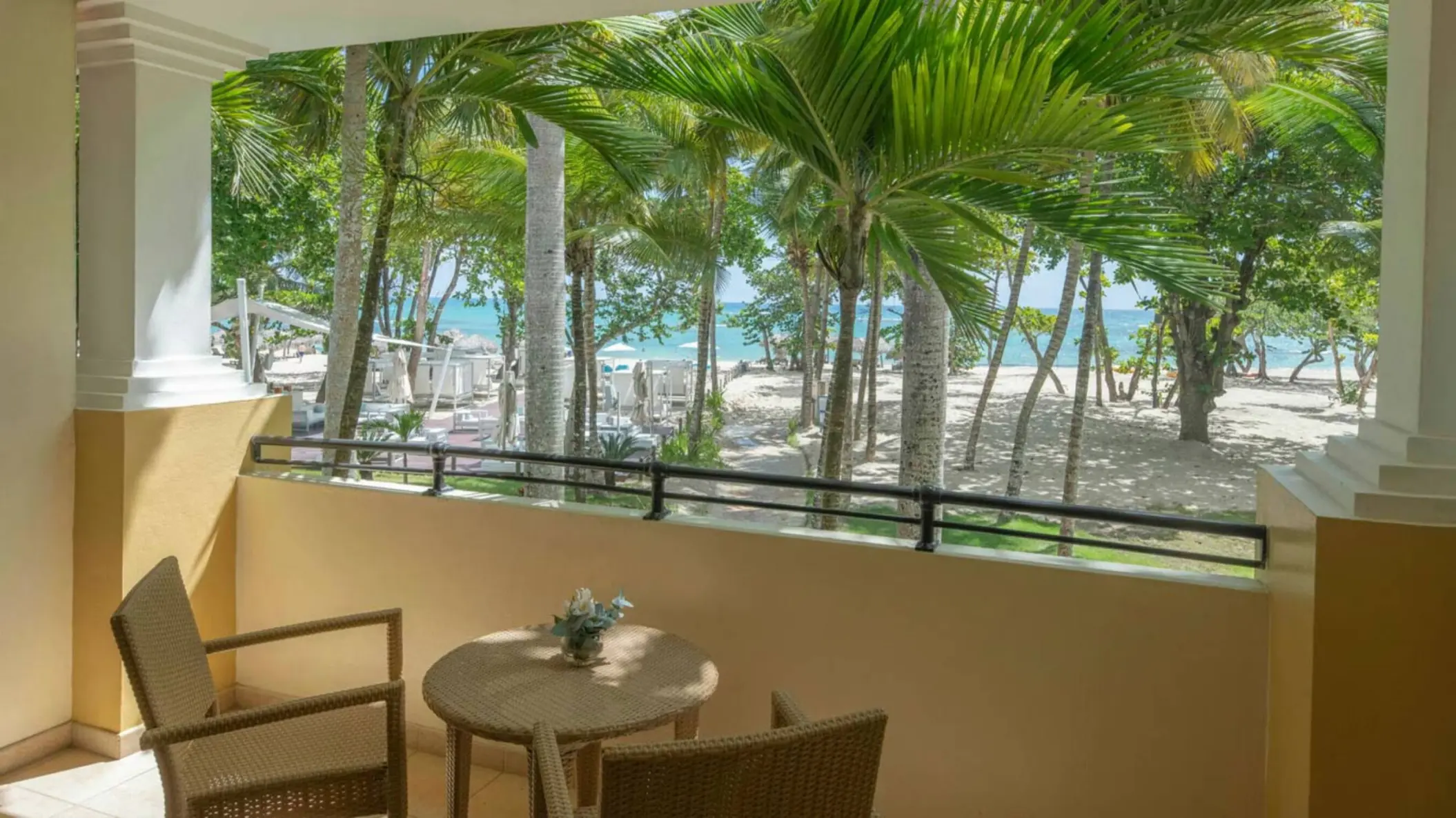 Private oceanview balcony with wicker seating at Iberostar Waves Costa Dorada, Puerto Plata