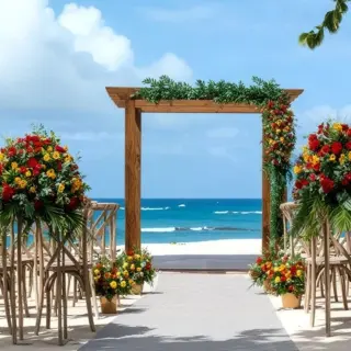 Beachfront wedding ceremony with a wooden arch and floral arrangements at Iberostar Waves Costa Dorada, Puerto Plata