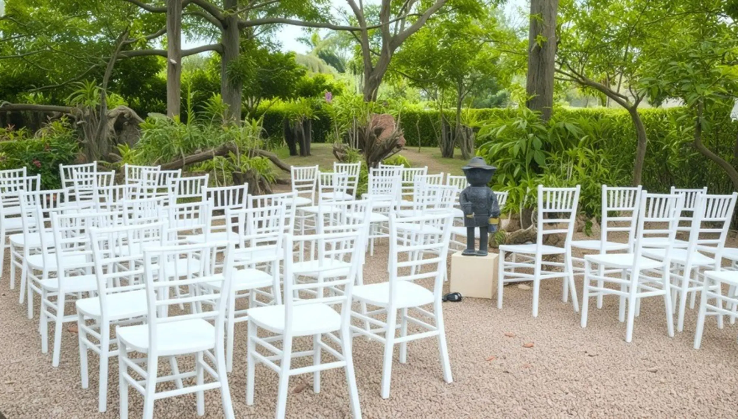 Orchid garden wedding ceremony venue with white chairs at Iberostar Waves Costa Dorada, Puerto Plata