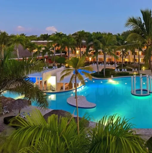 pool lit up in the evening at Iberostar Waves Costa Dorada