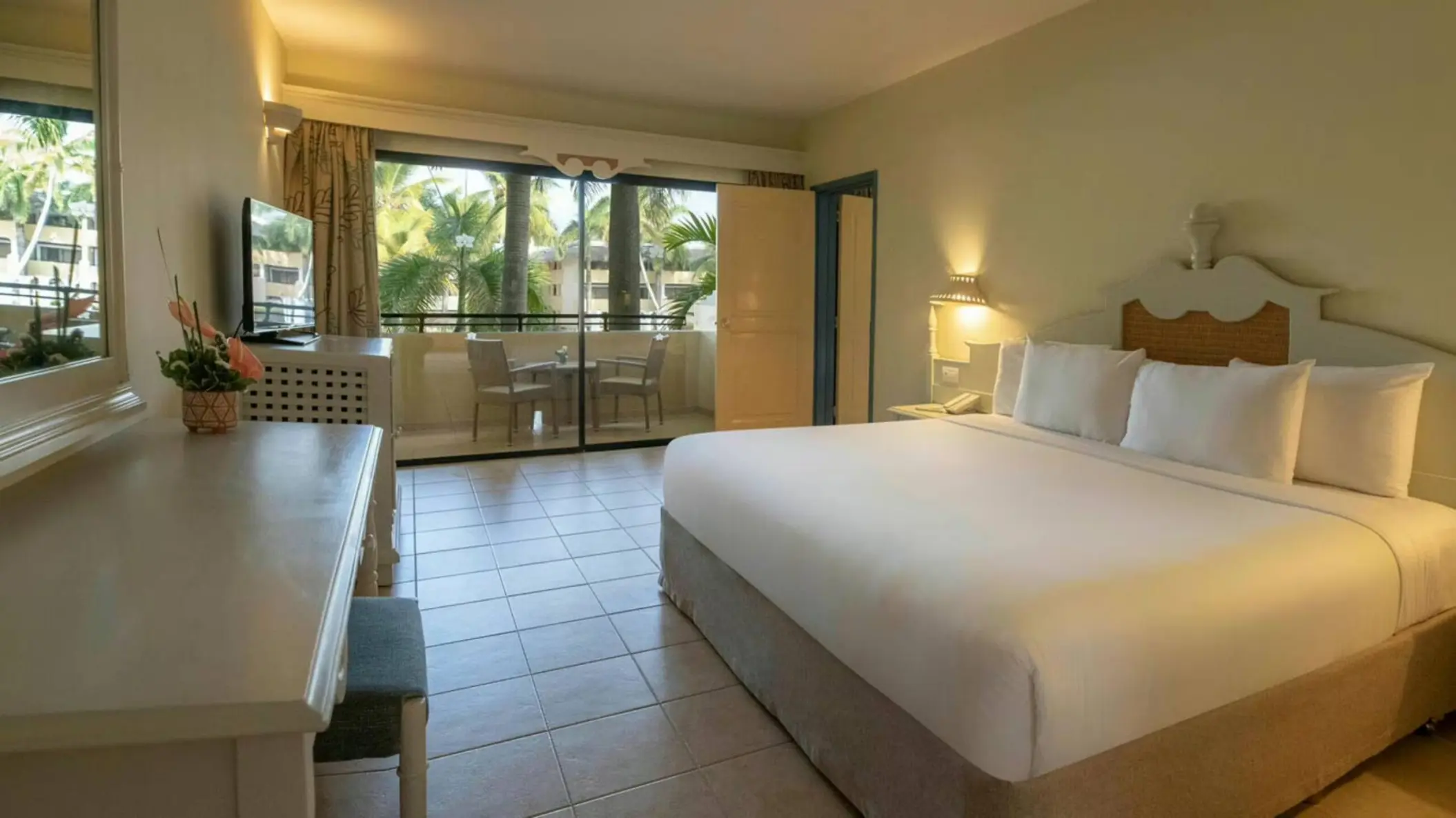 Guest room with white linens and private balcony at Iberostar Waves Costa Dorada, Puerto Plata