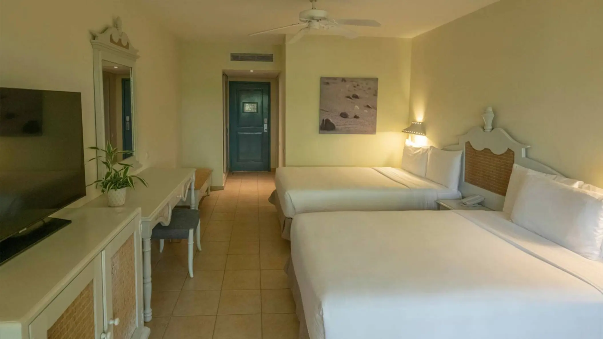 Guest room with two beds, white linens, and colonial-style furniture at Iberostar Waves Costa Dorada, Puerto Plata