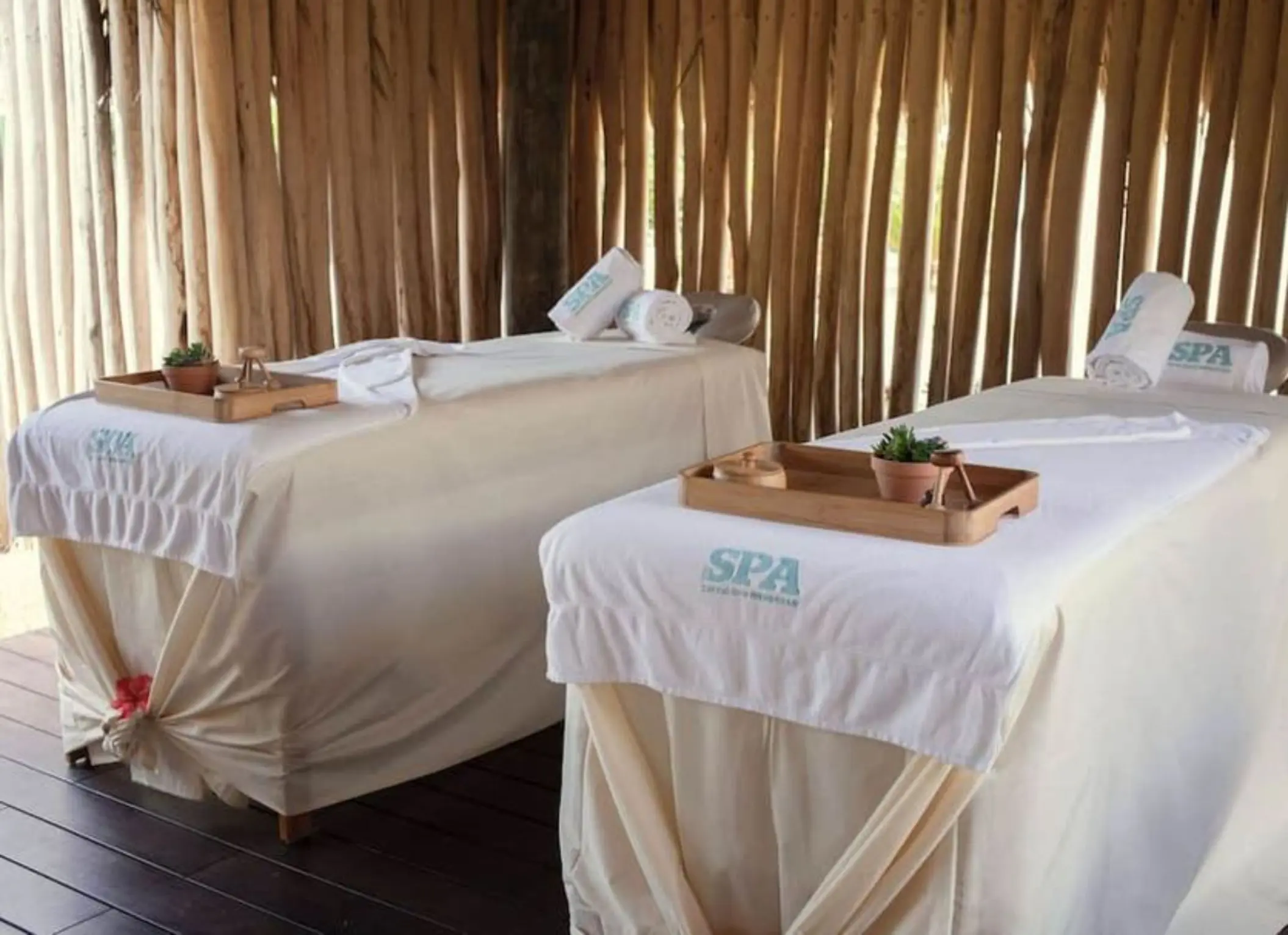 Couples massage beds with white linens at Iberostar Waves Costa Dorada, Puerto Plata