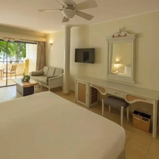 Iberostar Costa Dorada guest suite with a private balcony and seating area, Puerto Plata