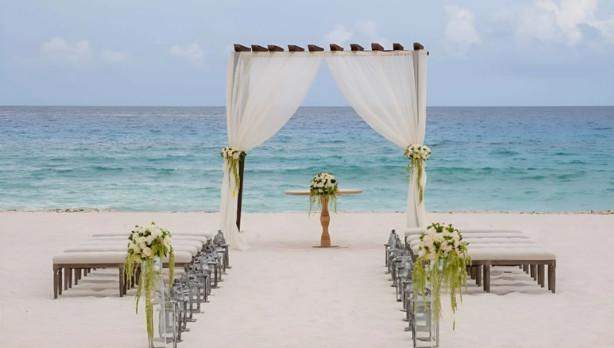 Beachfront wedding ceremony setup at Iberostar Waves Cozumel, Cozumel