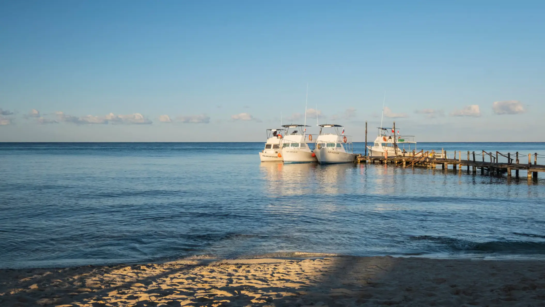 Boats moored at the Iberostar Waves Cozumel pier on the Caribbean Sea