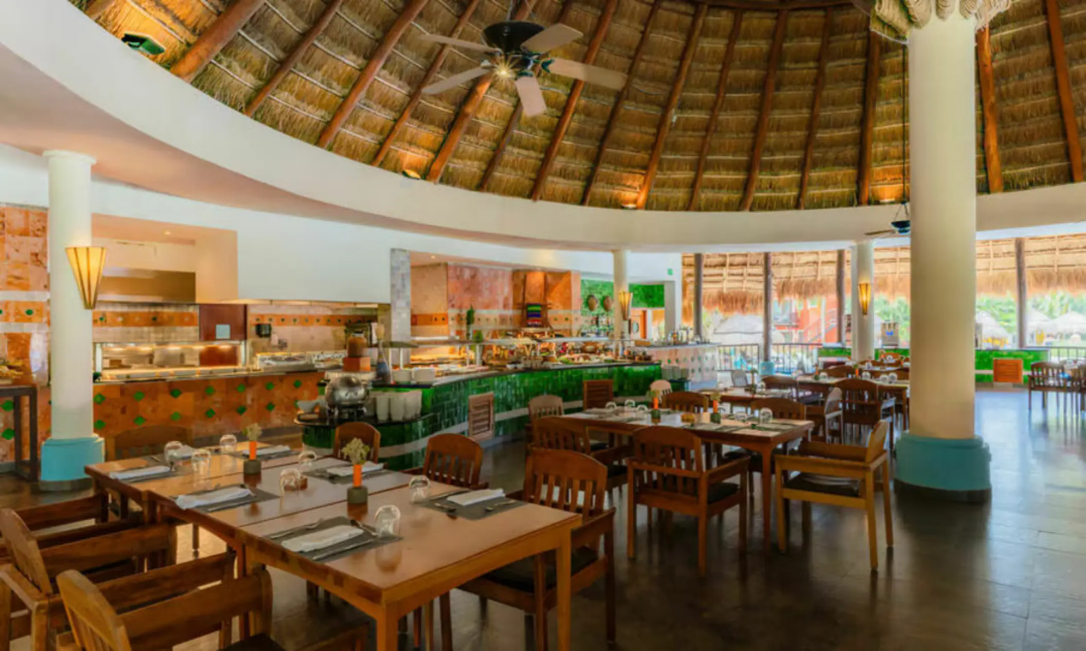 Buffet restaurant with a thatched palapa roof at Iberostar Waves Cozumel, Cozumel