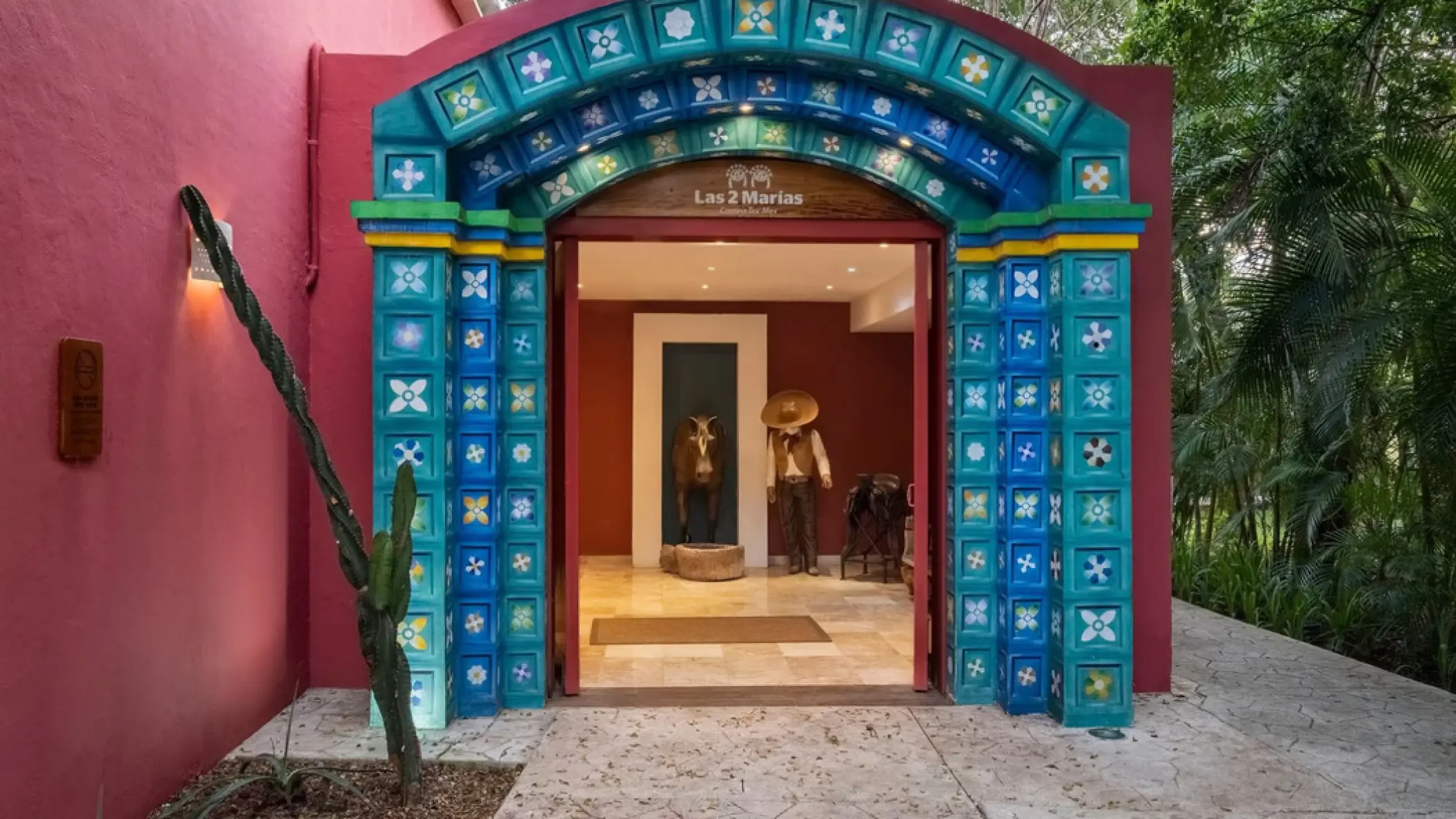 Las 2 Marias restaurant entrance with a blue tiled archway at Iberostar Waves Cozumel
