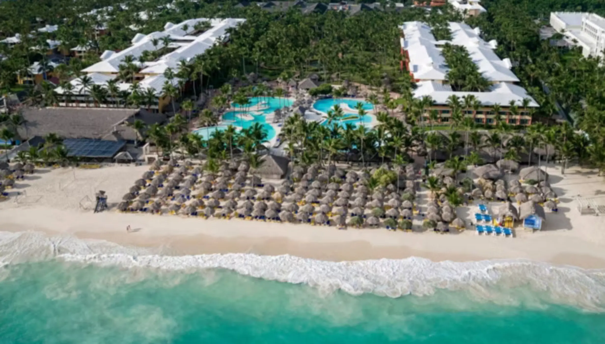 Aerial view of Iberostar Waves Dominicana beachfront, pools, and guest buildings, Punta Cana