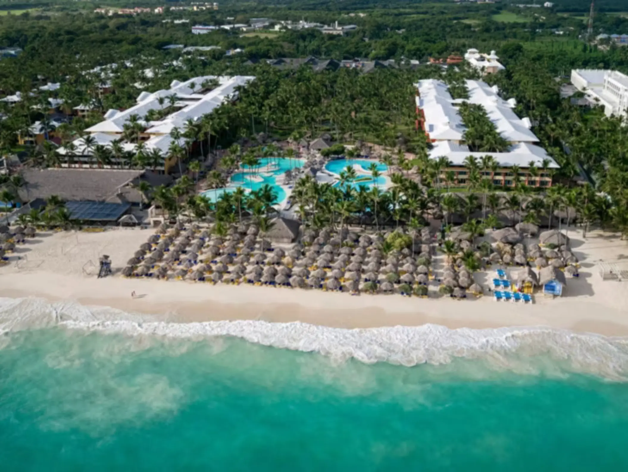Aerial view of Iberostar Waves Dominicana beachfront, pools, and guest buildings, Punta Cana