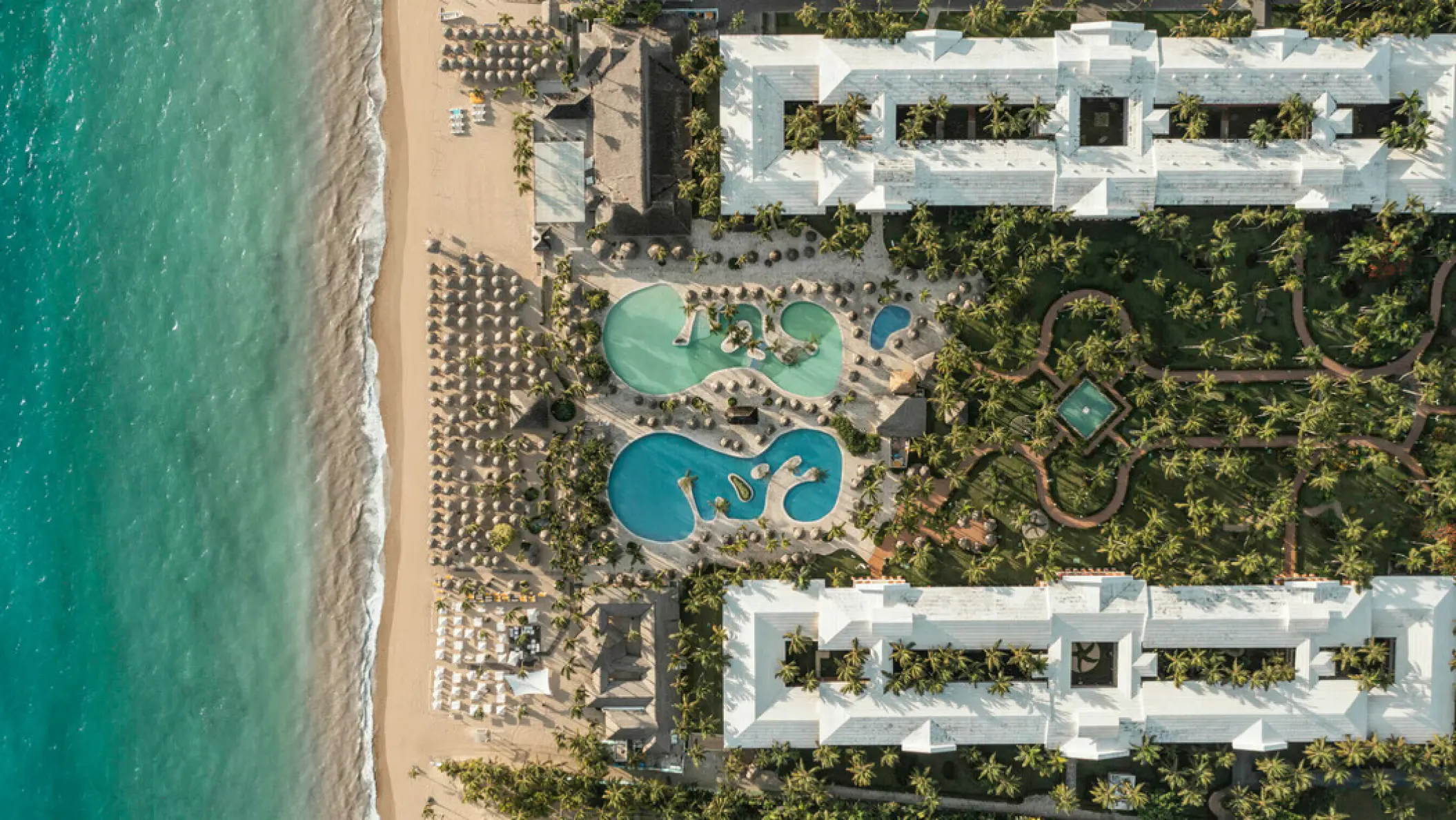 Aerial view of Iberostar Waves Dominicana pools and beachfront grounds, Punta Cana