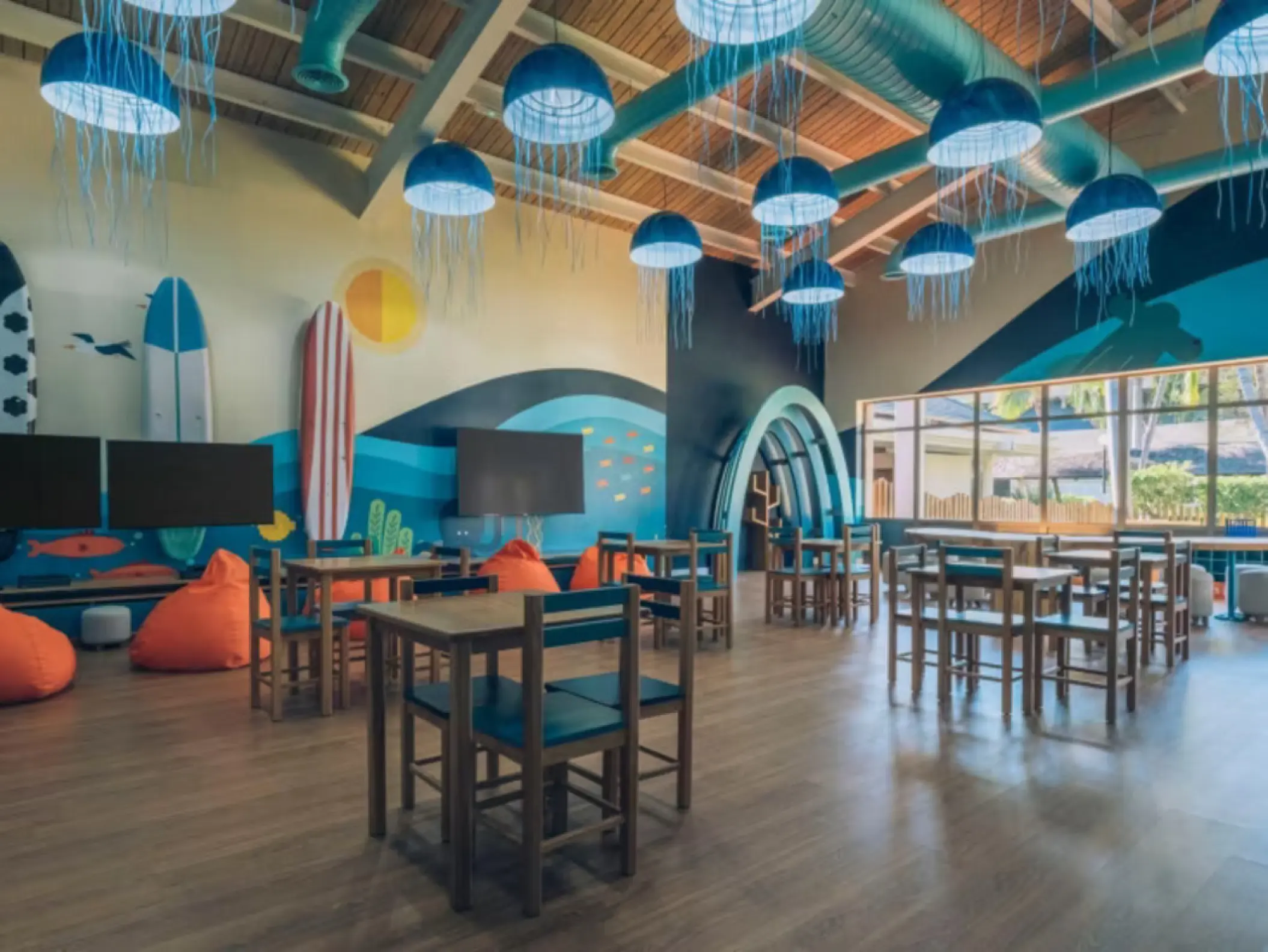 Colorful underwater-themed kids club with jellyfish lights at Iberostar Waves Dominicana, Punta Cana