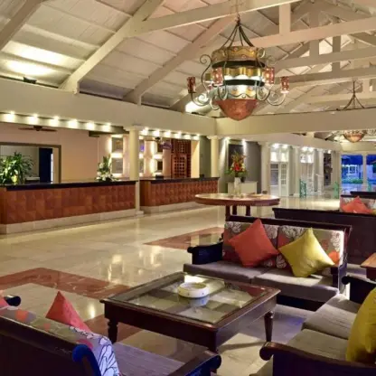 Open-air lobby lounge with vaulted ceilings and chandeliers at Iberostar Waves Dominicana, Punta Cana