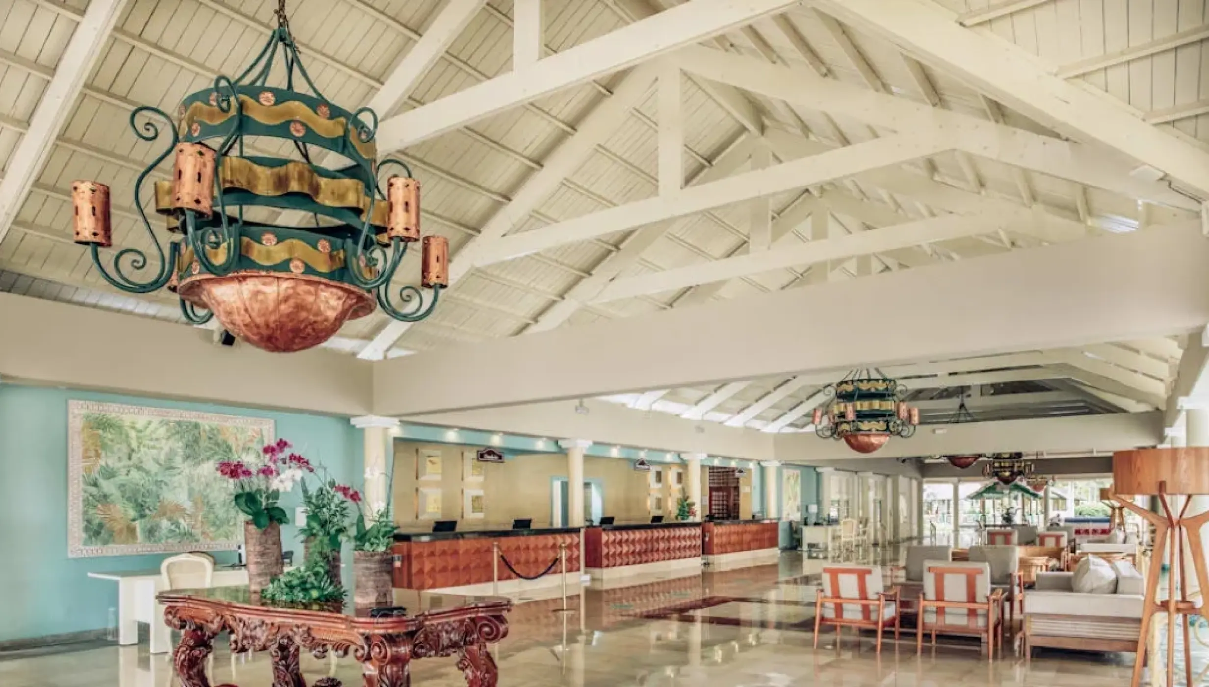 Open-air lobby with decorative chandeliers and vaulted ceilings at Iberostar Waves Dominicana, Punta Cana