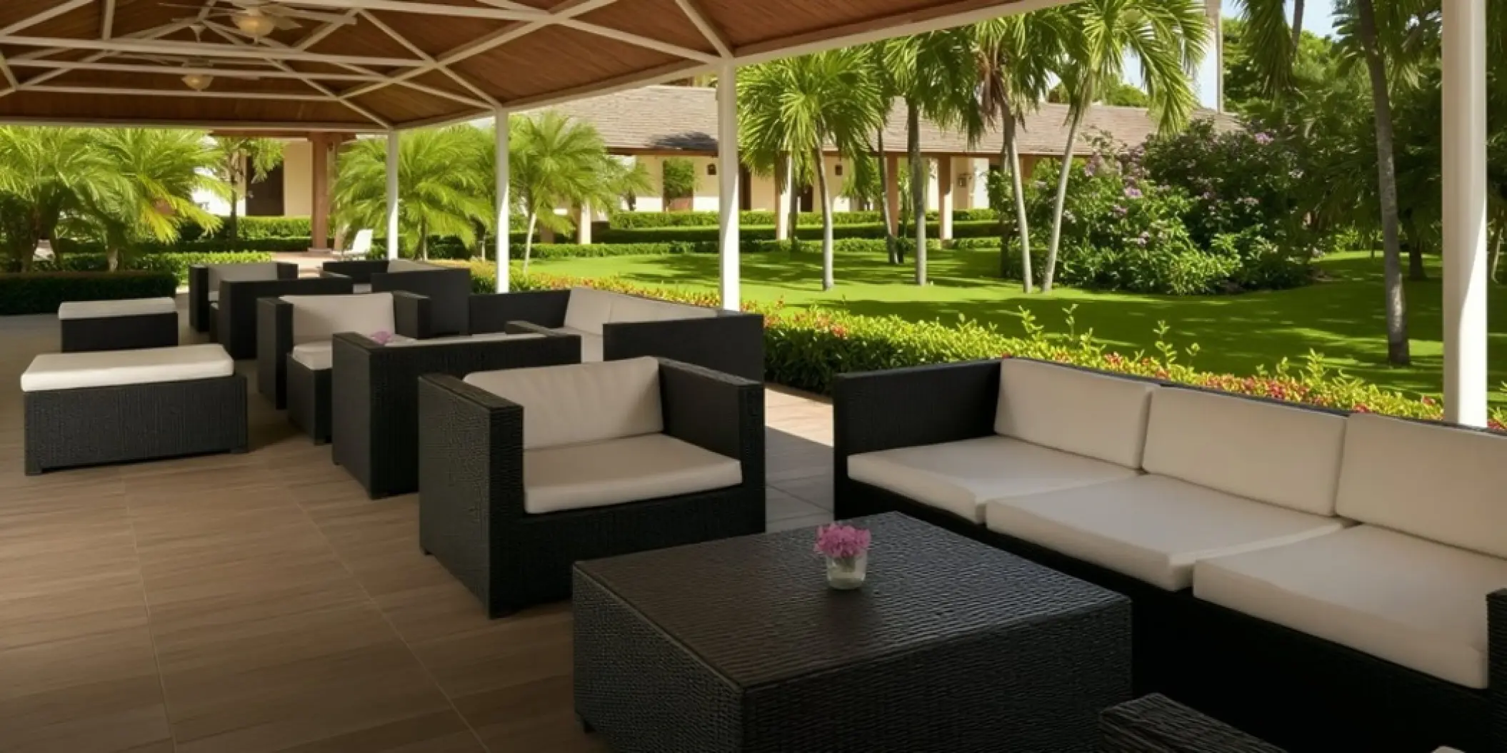 Patio terrace wedding reception lounge with wicker furniture at Iberostar Waves Dominicana, Punta Cana