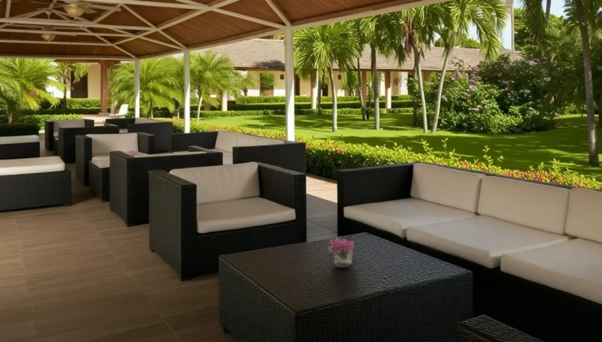Patio terrace wedding reception lounge with wicker furniture at Iberostar Waves Dominicana, Punta Cana