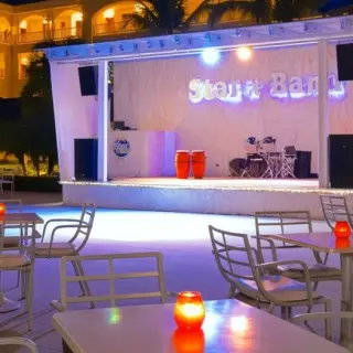 Plaza Musical outdoor stage and reception tables at Iberostar Waves Dominicana, Punta Cana