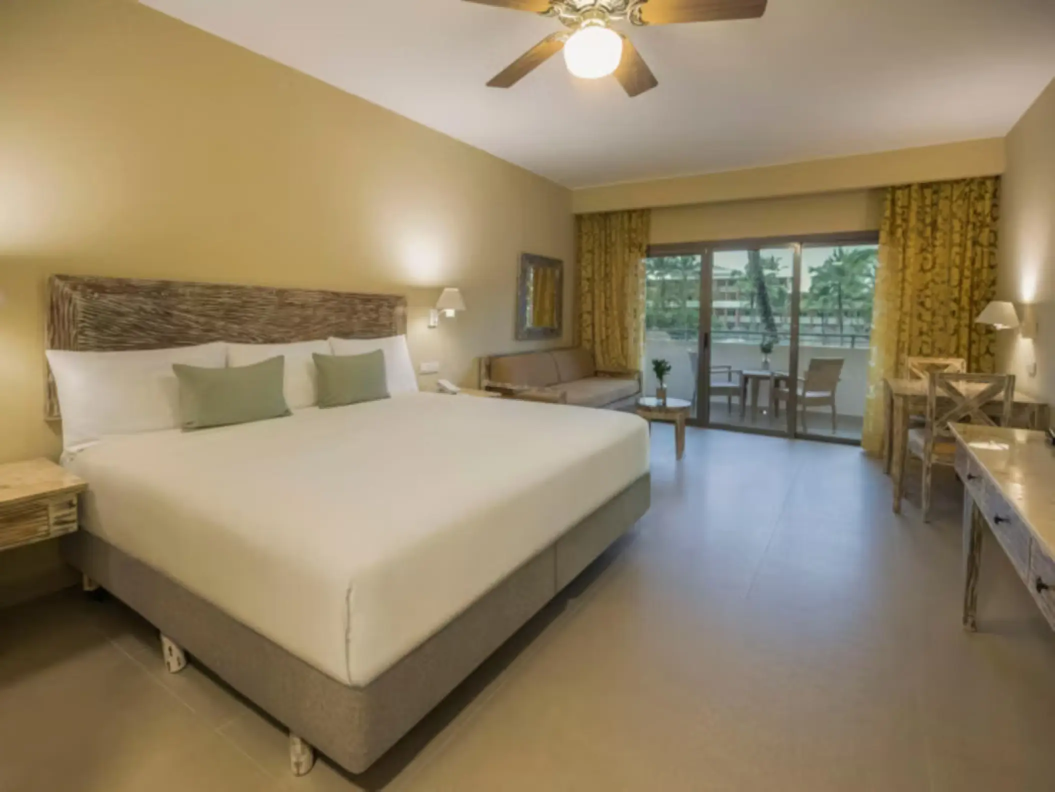 Guest room with king bed and private balcony at Iberostar Waves Dominicana, Punta Cana