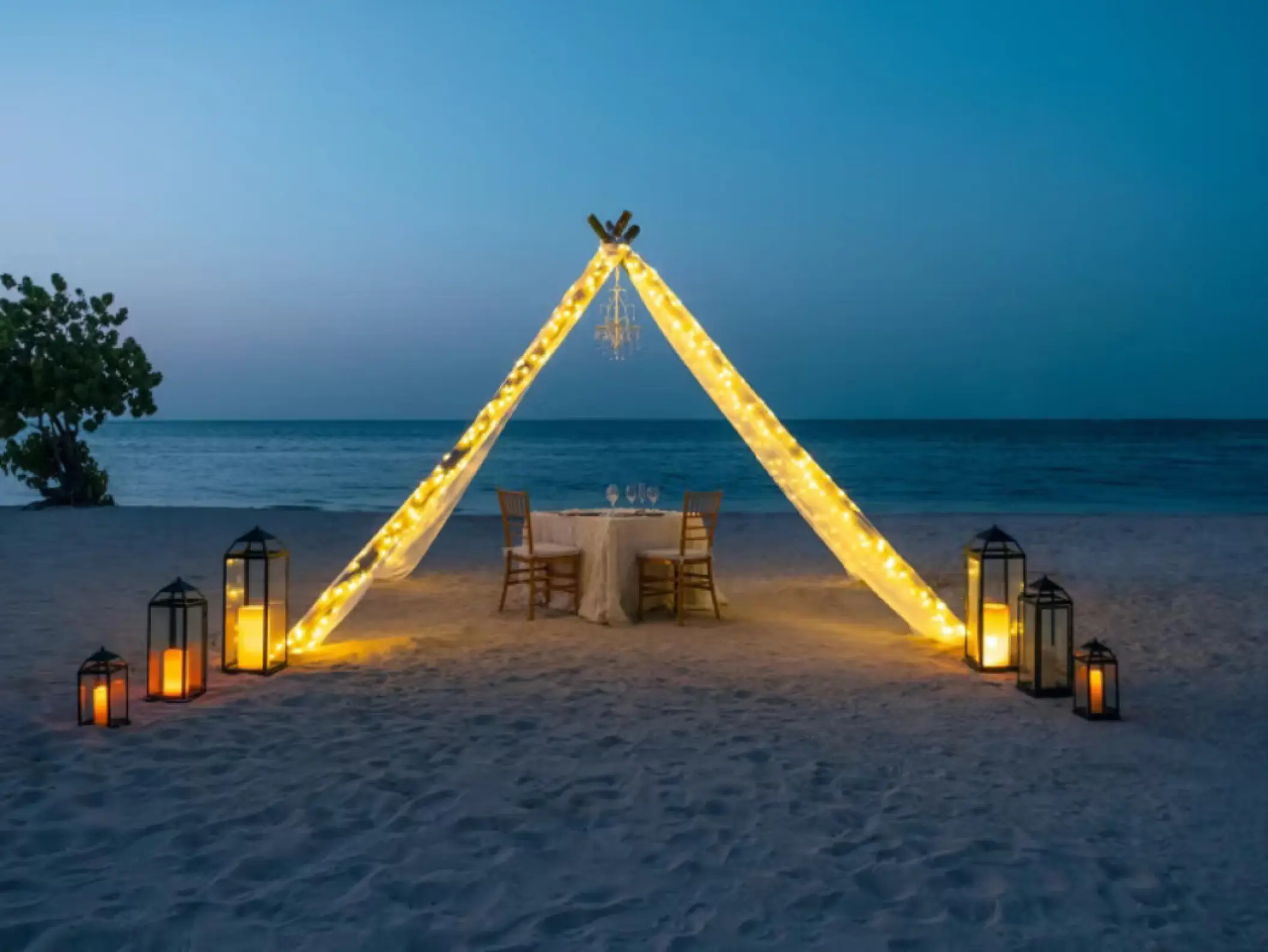 Private beach reception under a lighted tipi at Iberostar Waves Rose Hall Beach, Montego Bay
