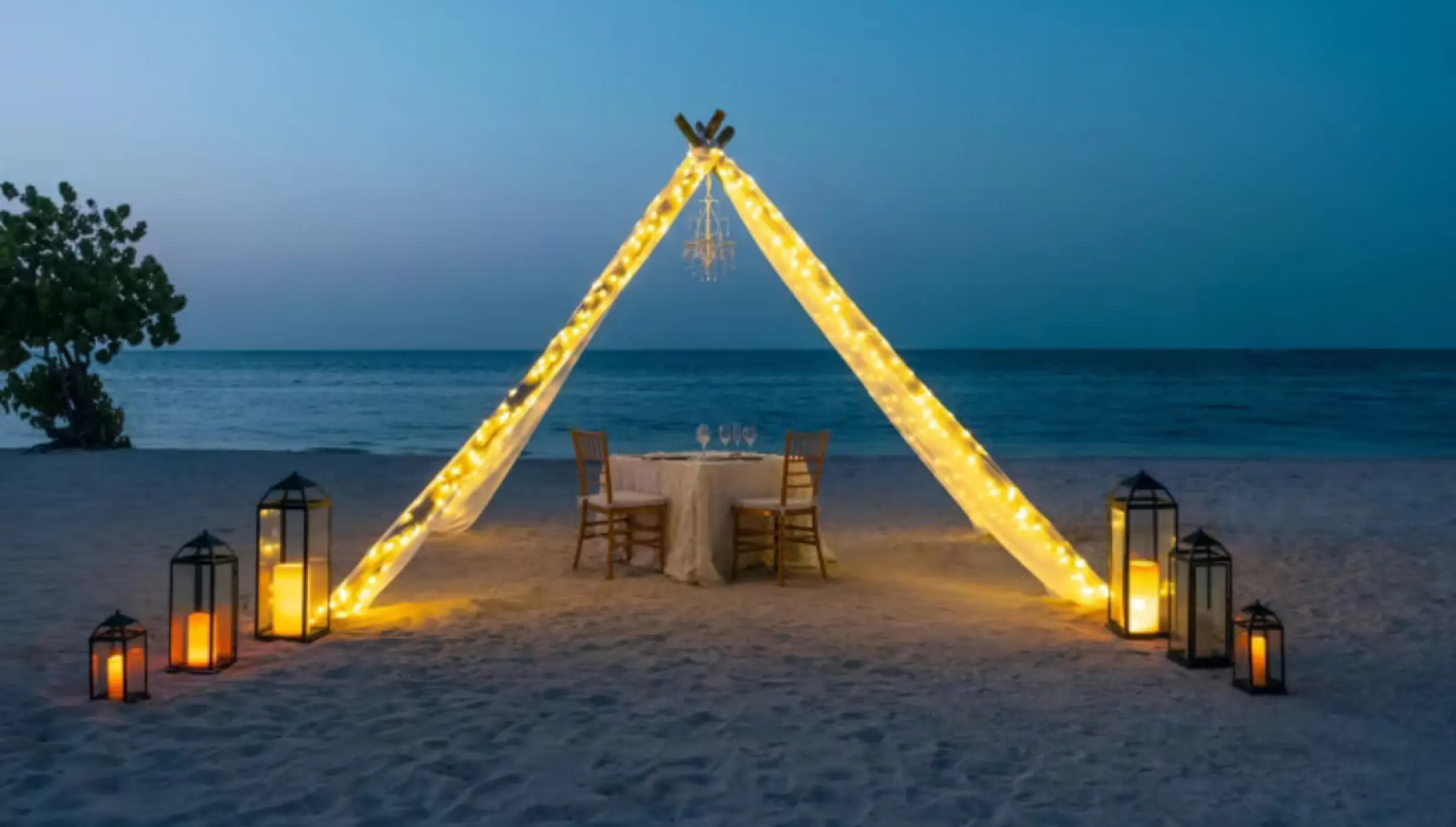 romantic dinner setup on the beach at Iberostar Waves Rose Hall Beach