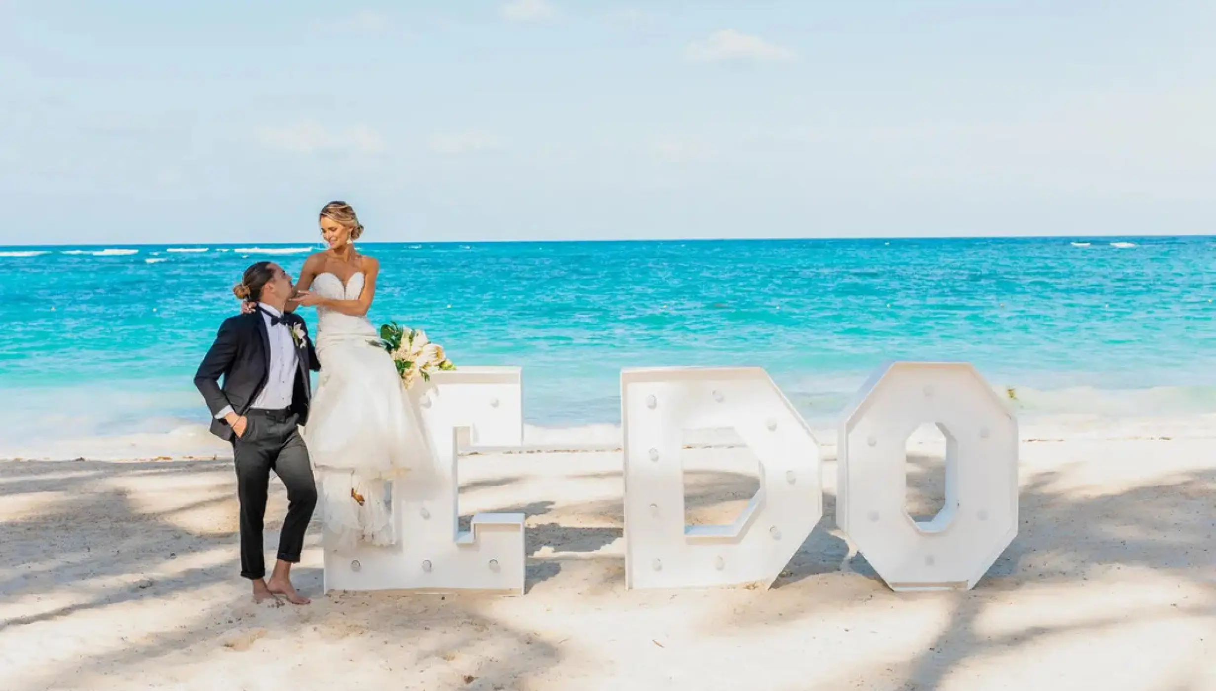 bride and groom on the beach venue at Iberostar Waves Rose Hall Beach
