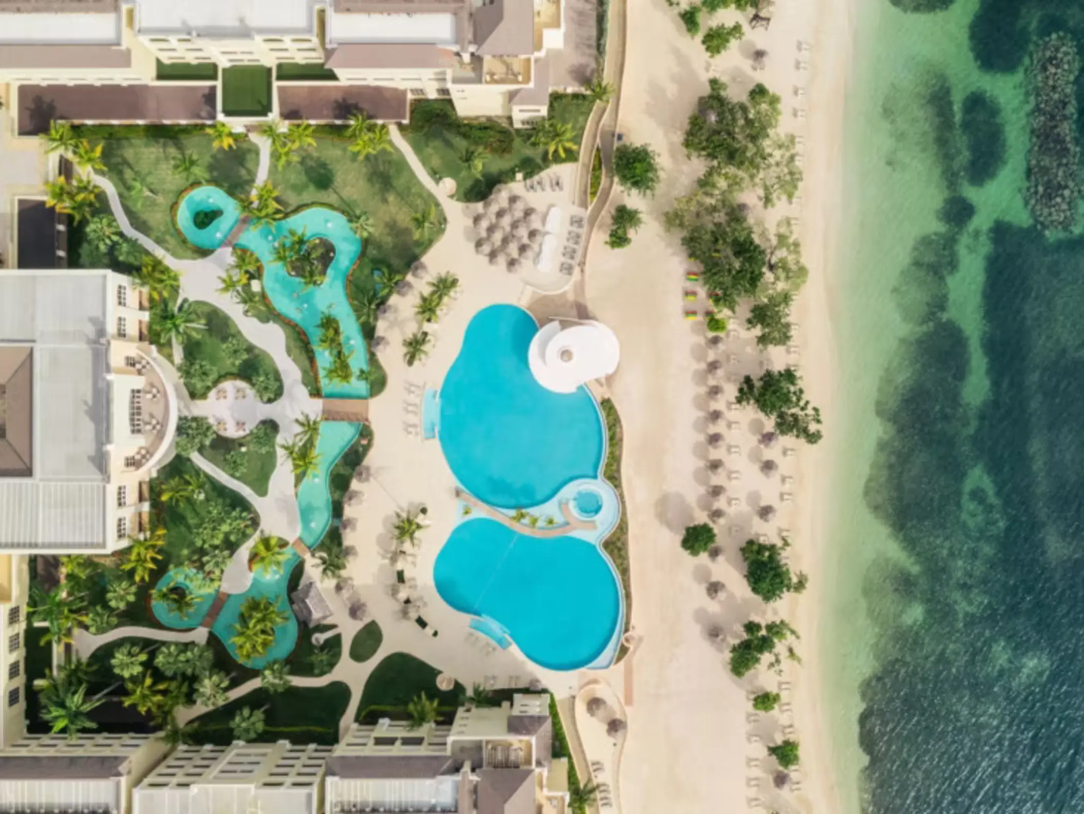Aerial view of pools and beachfront grounds at Iberostar Rose Hall Beach, Montego Bay