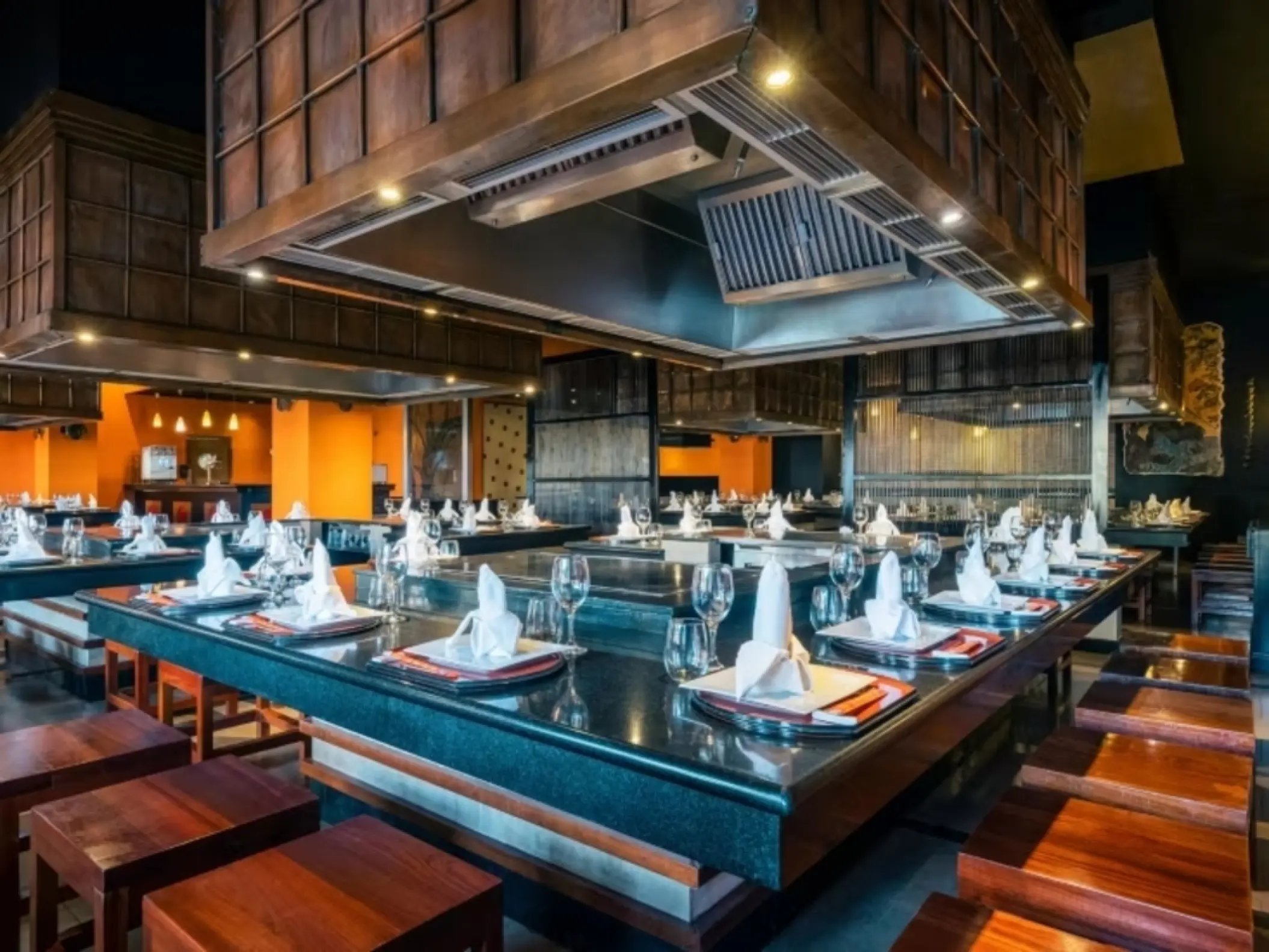 Teppanyaki dining room with set tables and wooden accents at Iberostar Rose Hall Beach, Montego Bay