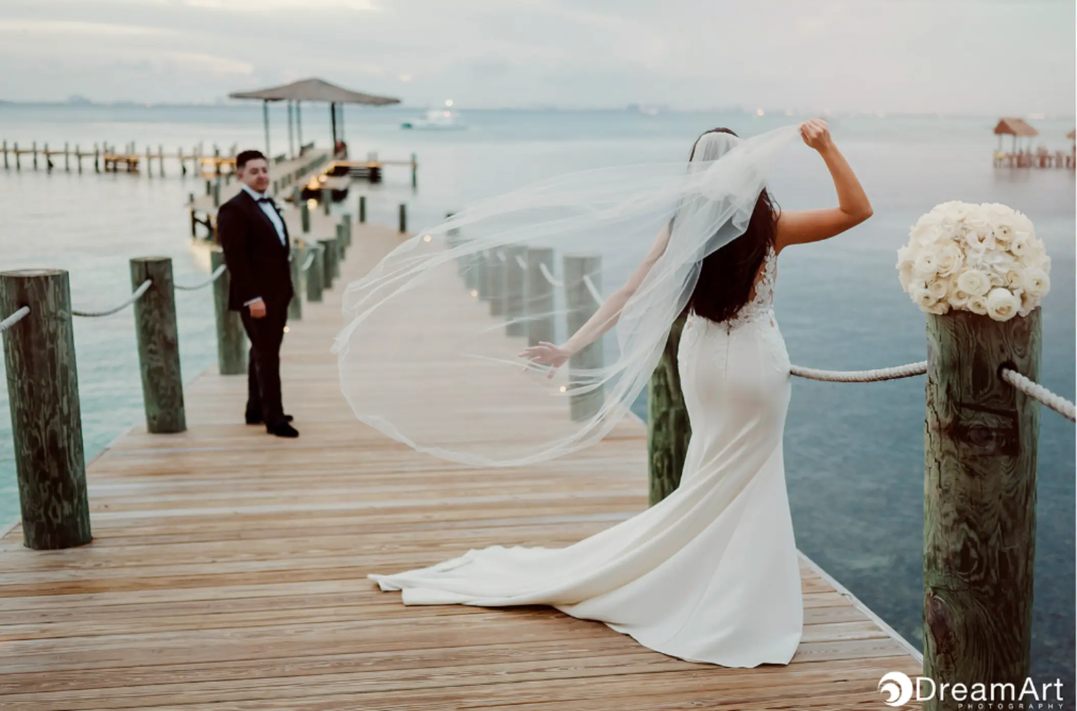Bride and groom portrait on the pier at Impression Isla Mujeres by Secrets