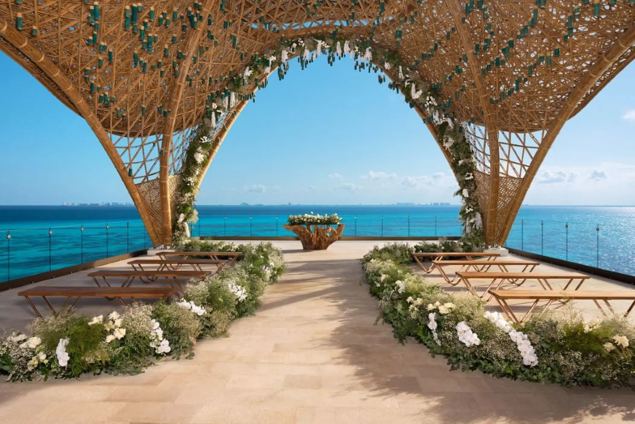 Terrace wedding ceremony under a woven bamboo structure at Impression Isla Mujeres by Secrets, Isla Mujeres