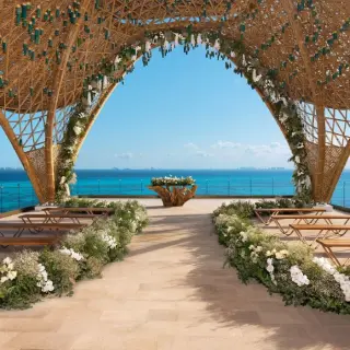 Terrace wedding ceremony under a woven bamboo structure at Impression Isla Mujeres by Secrets, Isla Mujeres