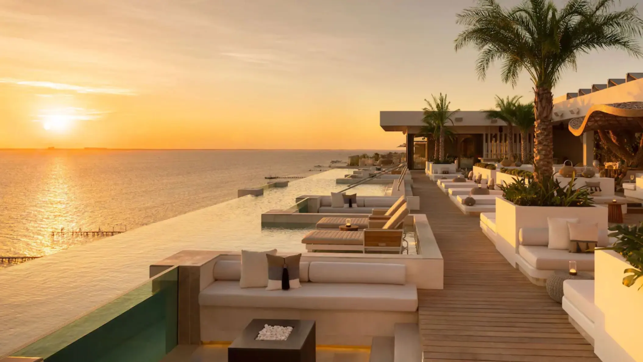 Rooftop infinity pool and lounge at sunset at Impression Isla Mujeres, Isla Mujeres