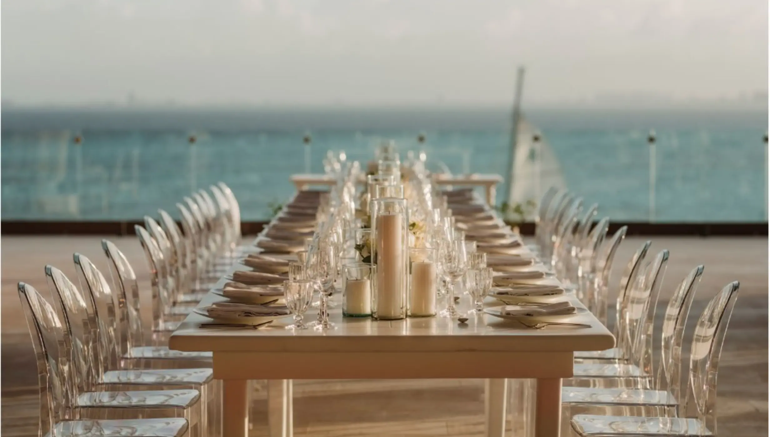 Long reception table with ghost chairs at Impression Isla Mujeres by Secrets, Isla Mujeres