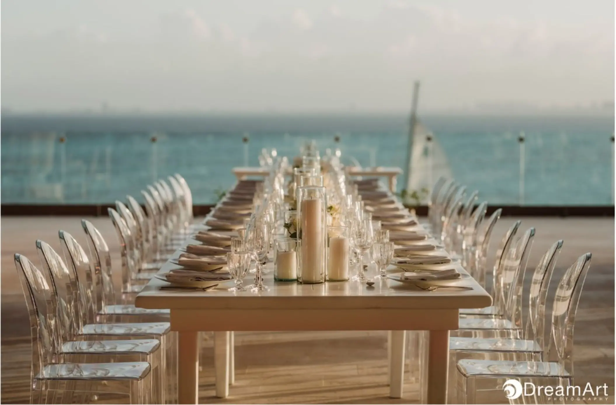 Long reception table with ghost chairs at Impression Isla Mujeres by Secrets, Isla Mujeres