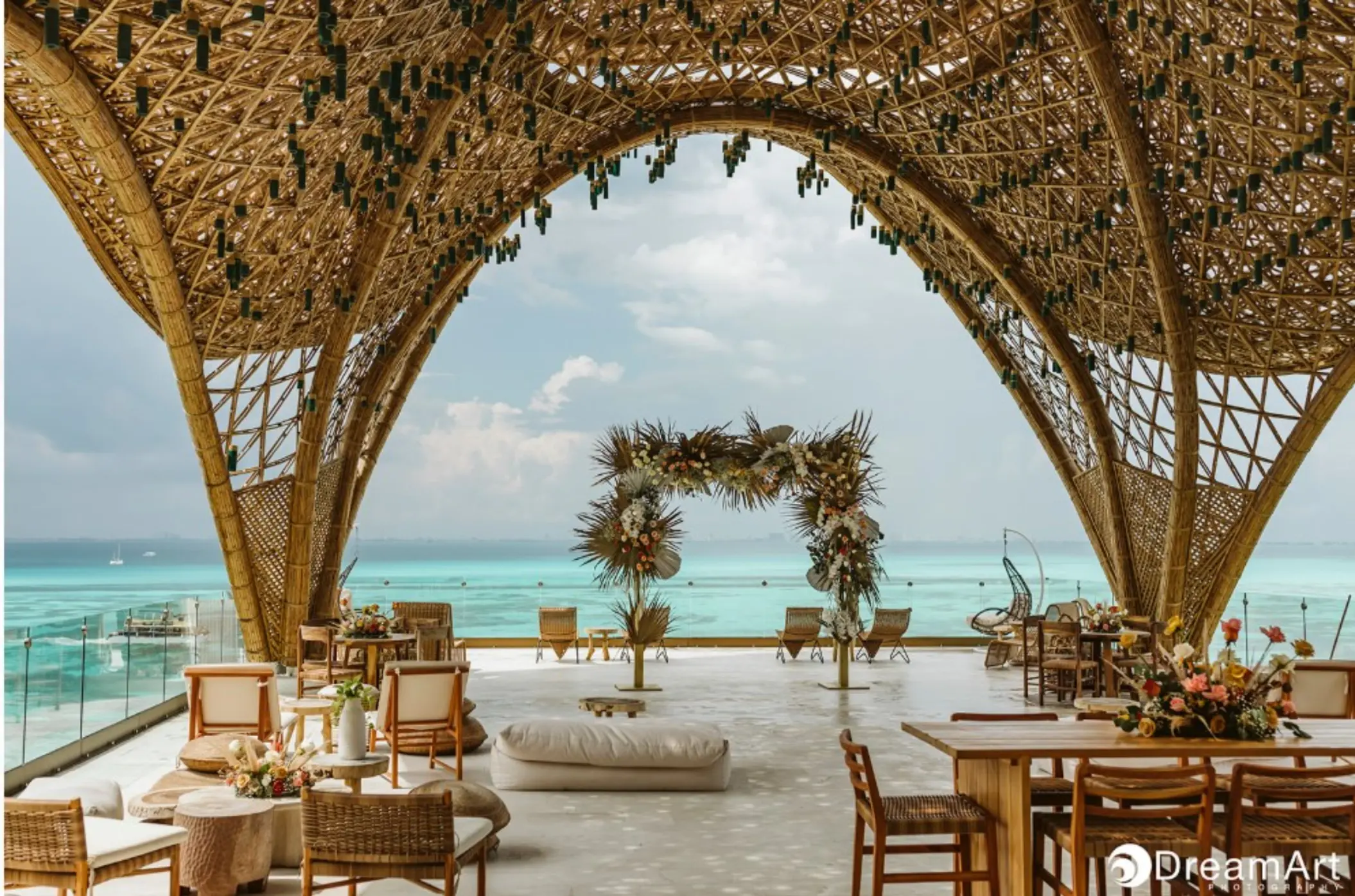 Temple wedding ceremony venue under a bamboo arch at Impression Isla Mujeres, Isla Mujeres