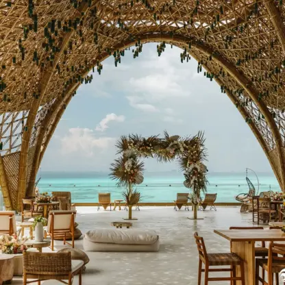 Temple wedding ceremony venue under a bamboo arch at Impression Isla Mujeres, Isla Mujeres