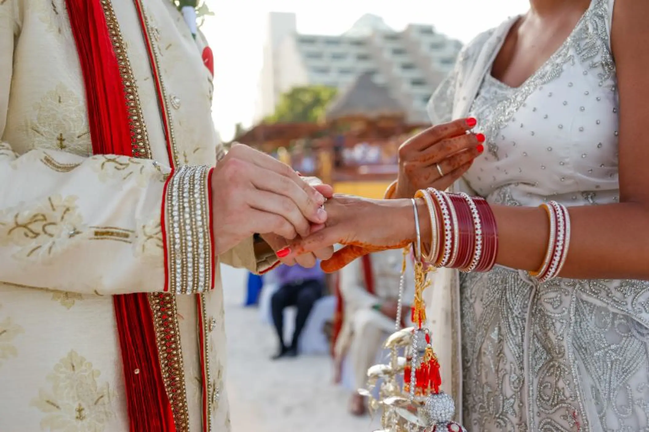 Exchange of rings during an Indian wedding ceremony at Secrets Tides Punta Cana