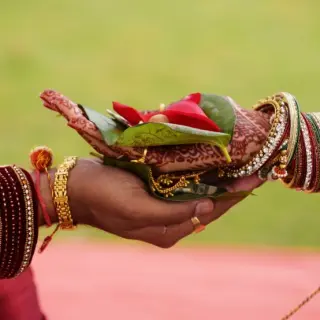 Close-up of hands during a South Asian wedding ceremony at Secrets Tides, Punta Cana