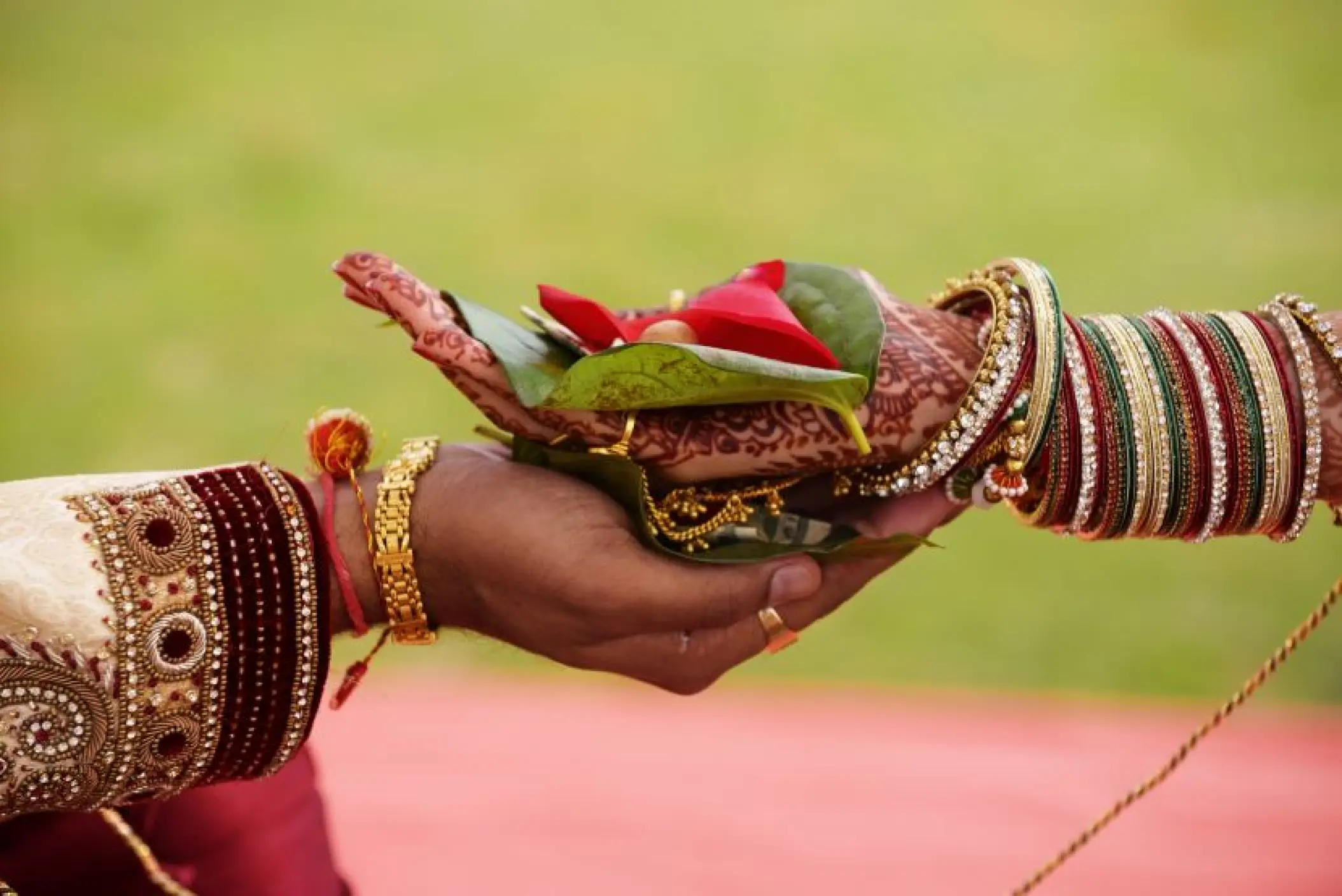 Close-up of hands during a South Asian wedding ceremony at Secrets Tides, Punta Cana