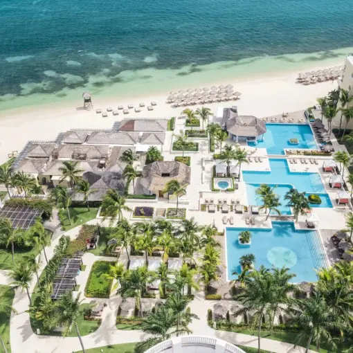 Aerial view of the pools, beachfront, and grounds at JOIA Rose Hall by Iberostar, Montego Bay