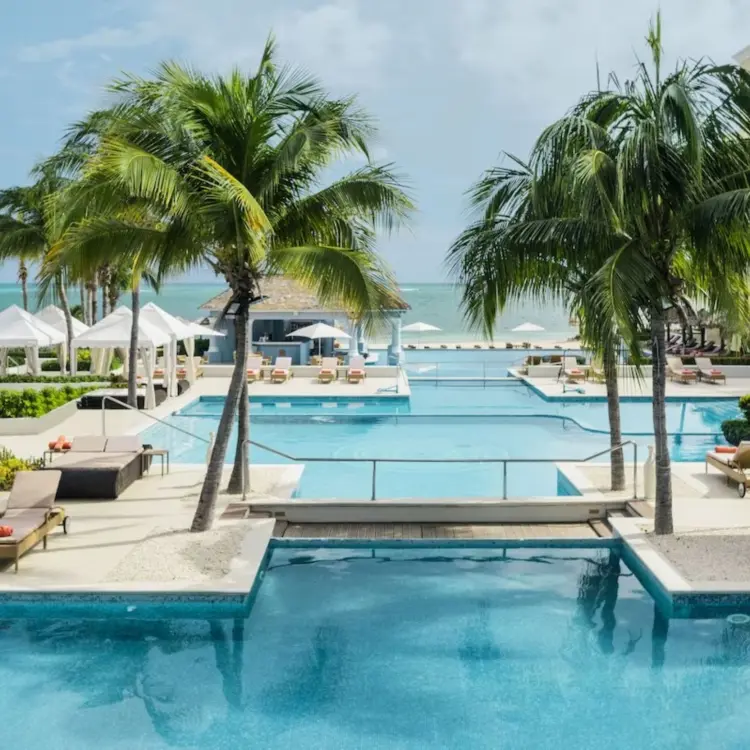 JOIA Rose Hall beachfront swimming pools and white cabanas, Montego Bay
