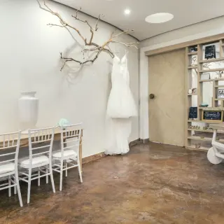 Wedding dress hanging in a bridal room at JOIA Rose Hall, Montego Bay