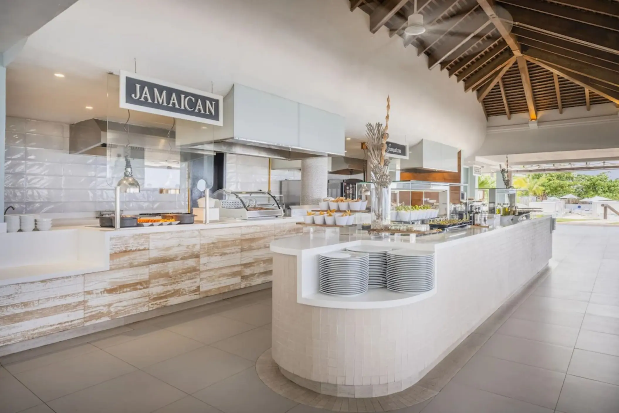Buffet restaurant food stations with vaulted wood ceilings at JOIA Rose Hall by Iberostar, Montego Bay