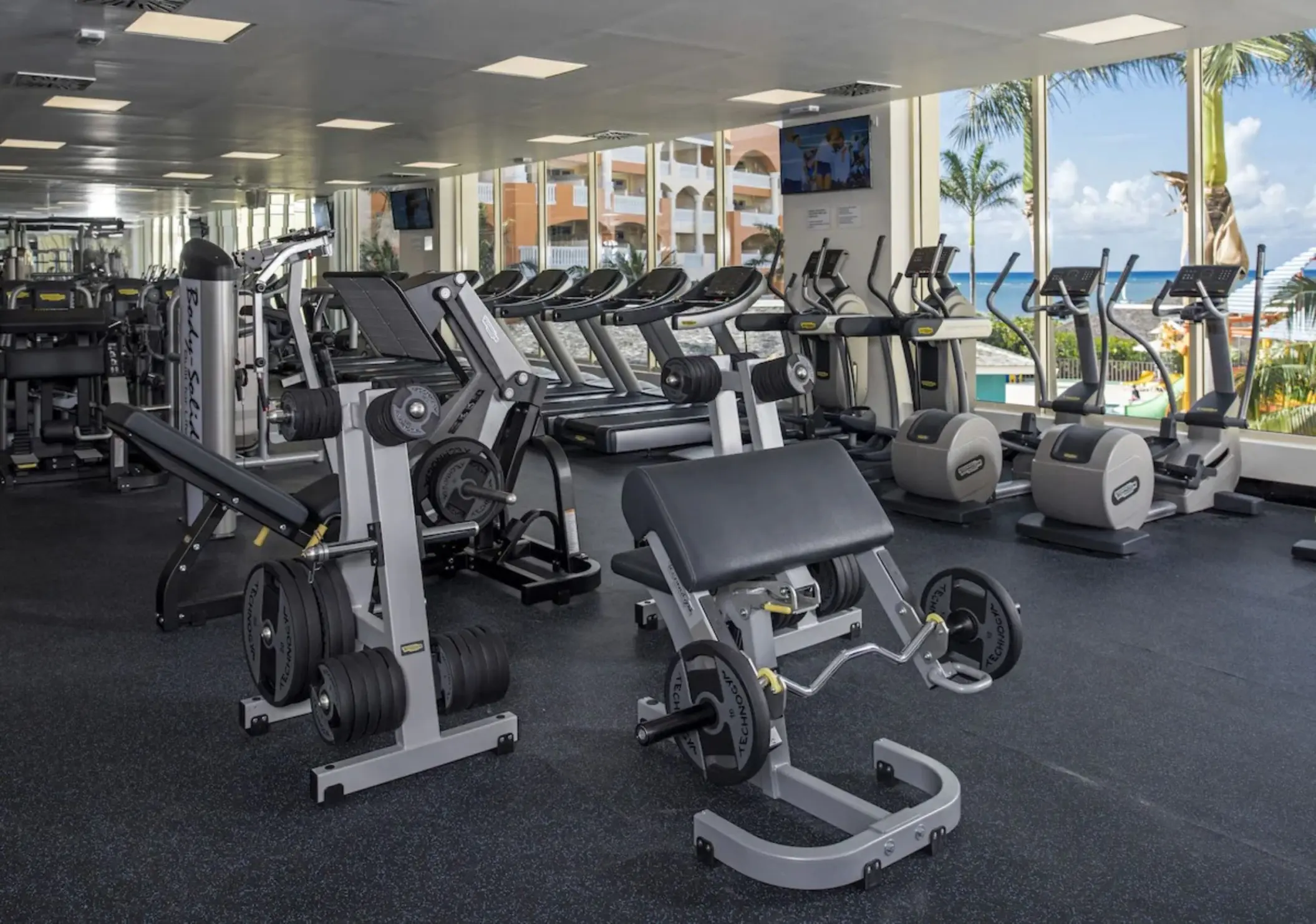 Weight machines and cardio equipment in the gym at JOIA Rose Hall, Montego Bay