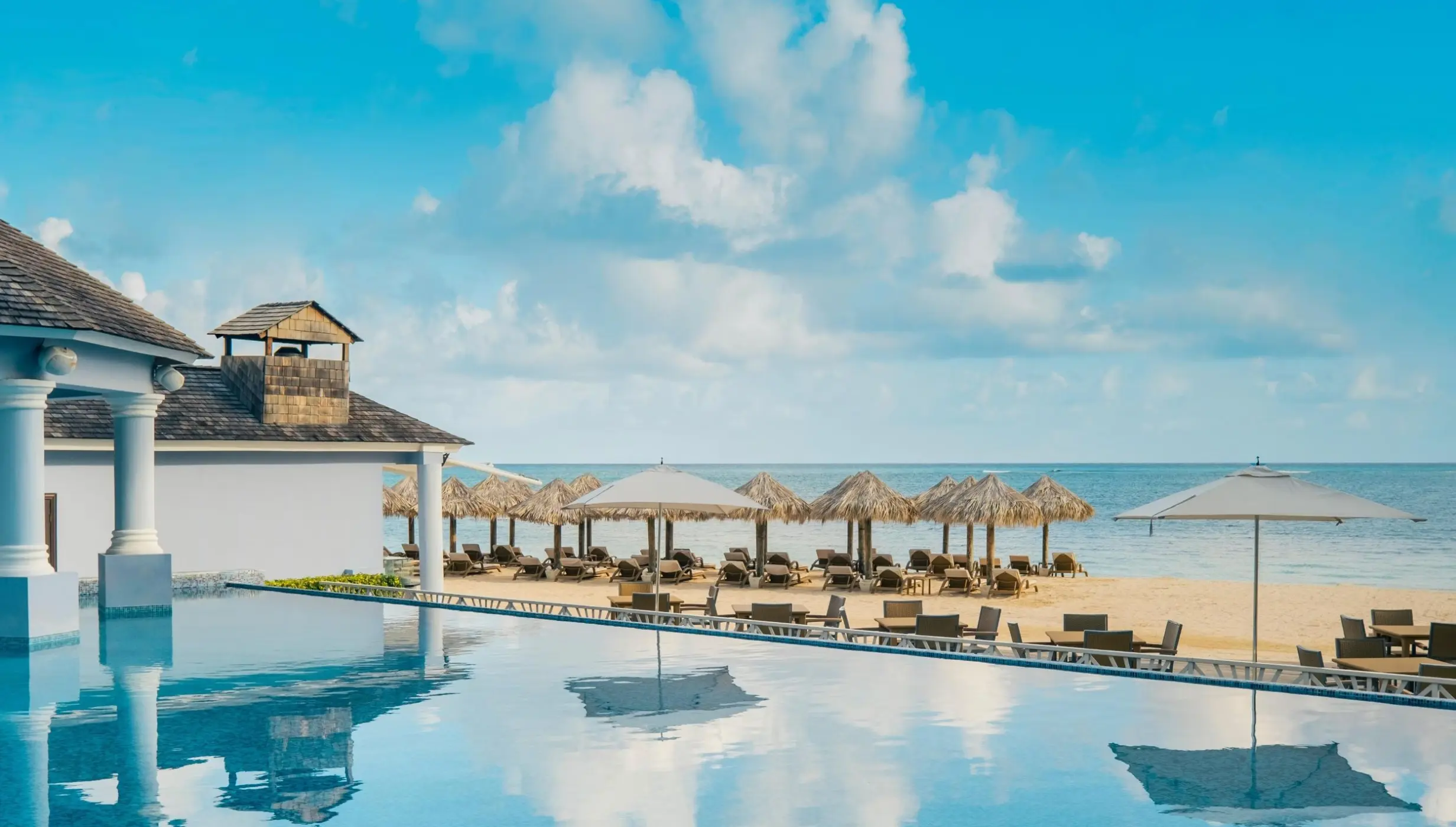 Infinity pool deck at JOIA Rose Hall by Iberostar