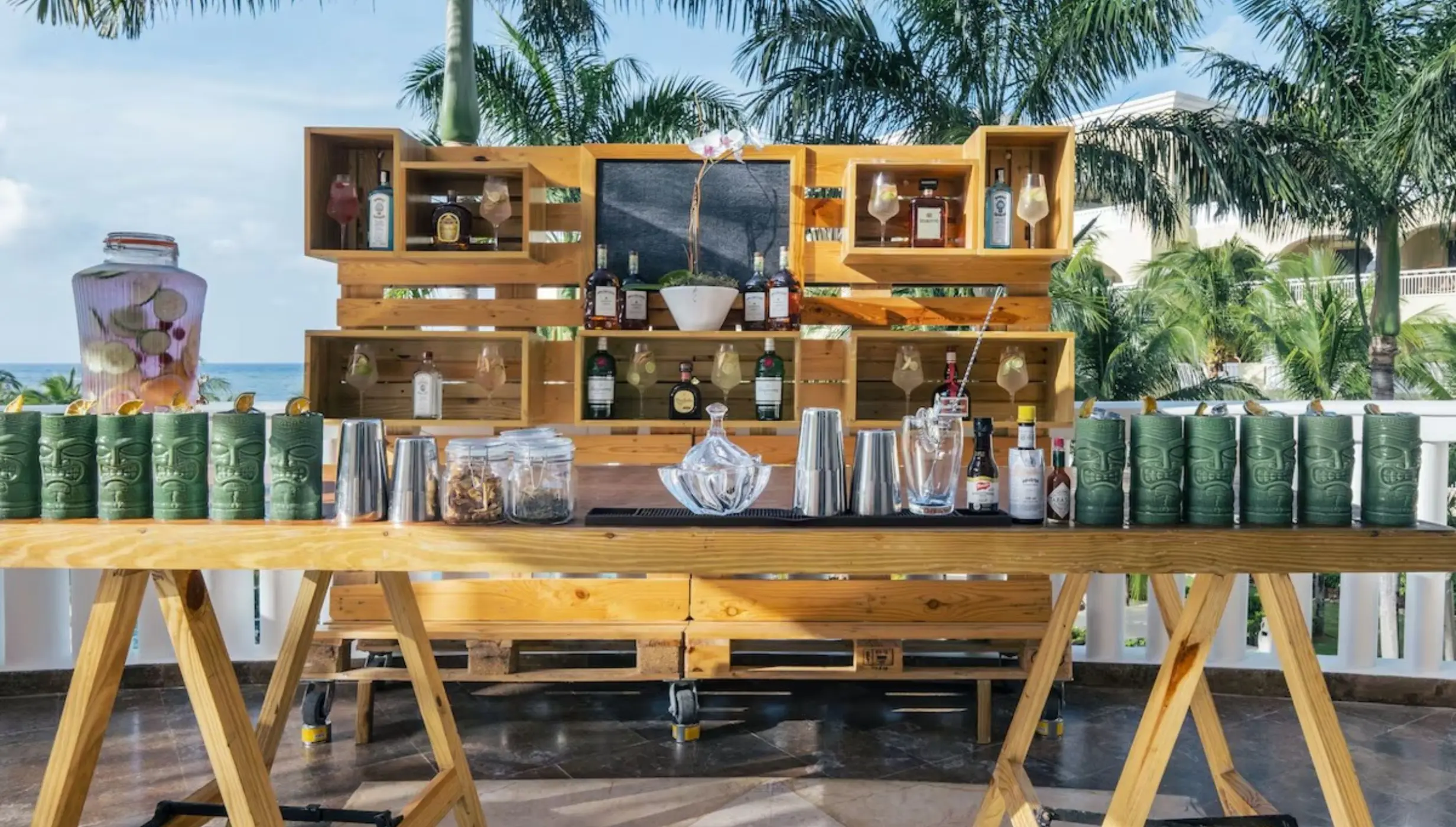 Rustic wooden bar setup for a cocktail reception at JOIA Rose Hall, Montego Bay
