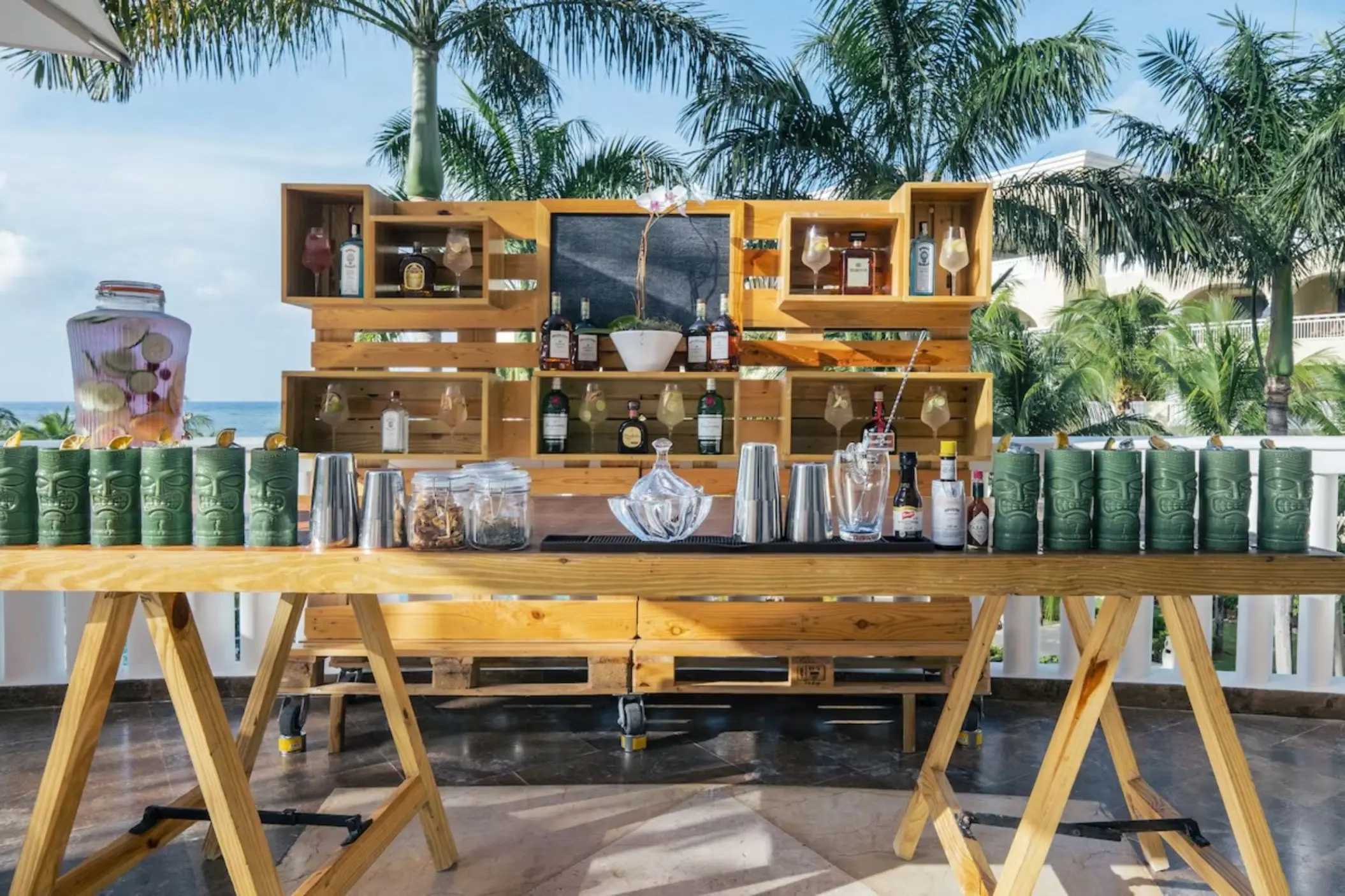 Rustic wooden bar setup for a cocktail reception at JOIA Rose Hall, Montego Bay