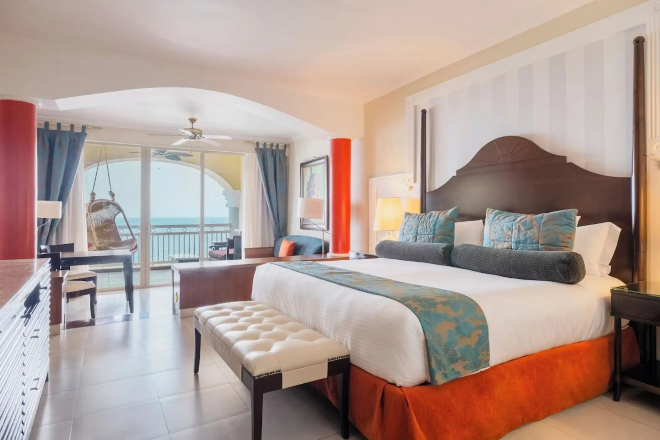Ocean view suite with a private balcony and hanging chair at JOIA Rose Hall, Montego Bay