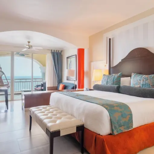 Ocean view suite with a private balcony and hanging chair at JOIA Rose Hall, Montego Bay